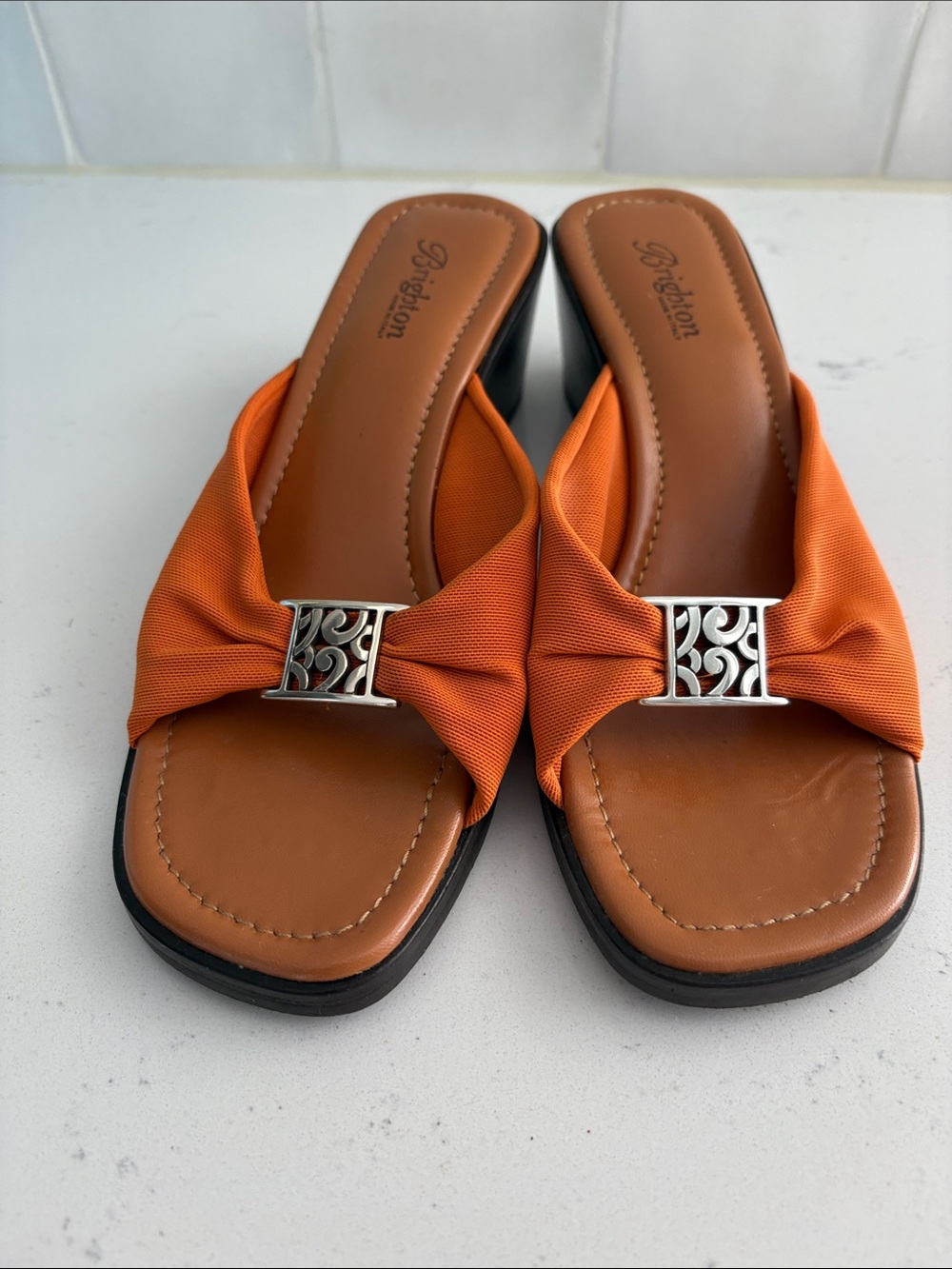 Brighton Orange Knotted Slide Wedges
with Silver Accent-Size 9